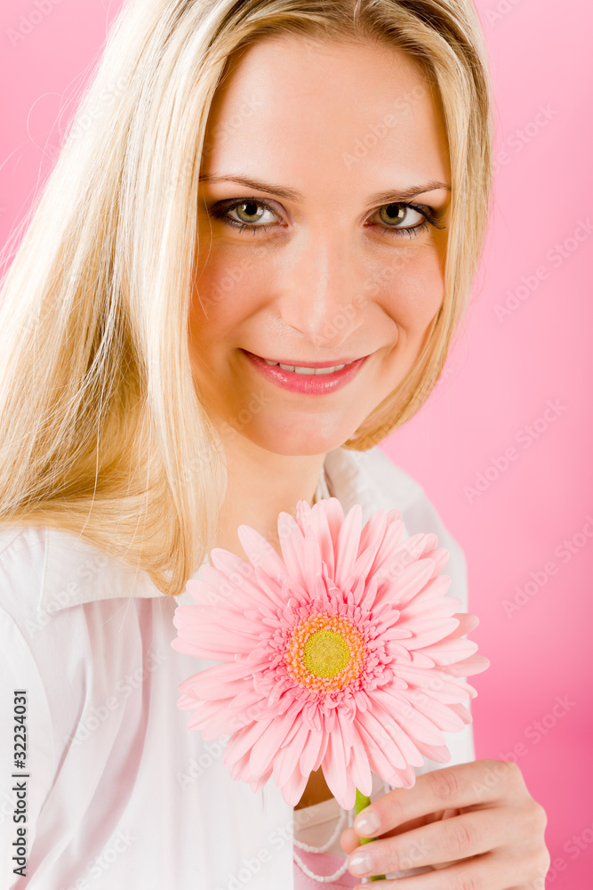 Romantic woman hold pink gerbera daisy flower Romantic woman hold pink gerbera daisy flower