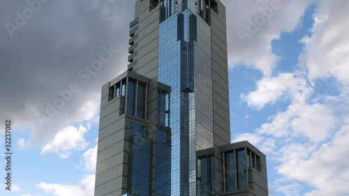 Clouds passes at background of tall building, time lapse photo