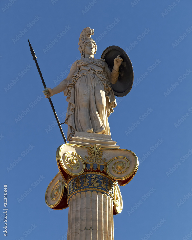 Athena (Minerva) statue on ionian column, blue sky Athena (Minerva) statue on ionian column, blue sky