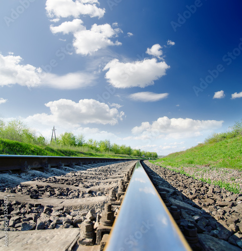 low angle view of railway under cloudy sky