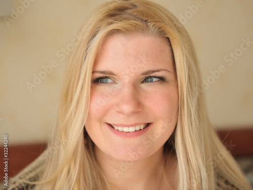 Pretty casual smiling woman portrait indoors