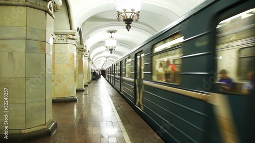 train arrives at subway station photo