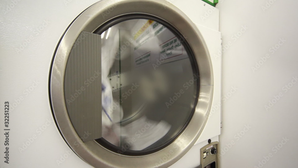washing machine, glass door is spinning drum with laundry washing machine, glass door is spinning drum with laundry