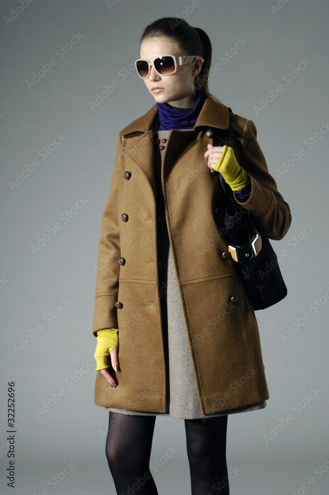 Portrait of a styled professional model on gray background Portrait of a styled professional model on gray background