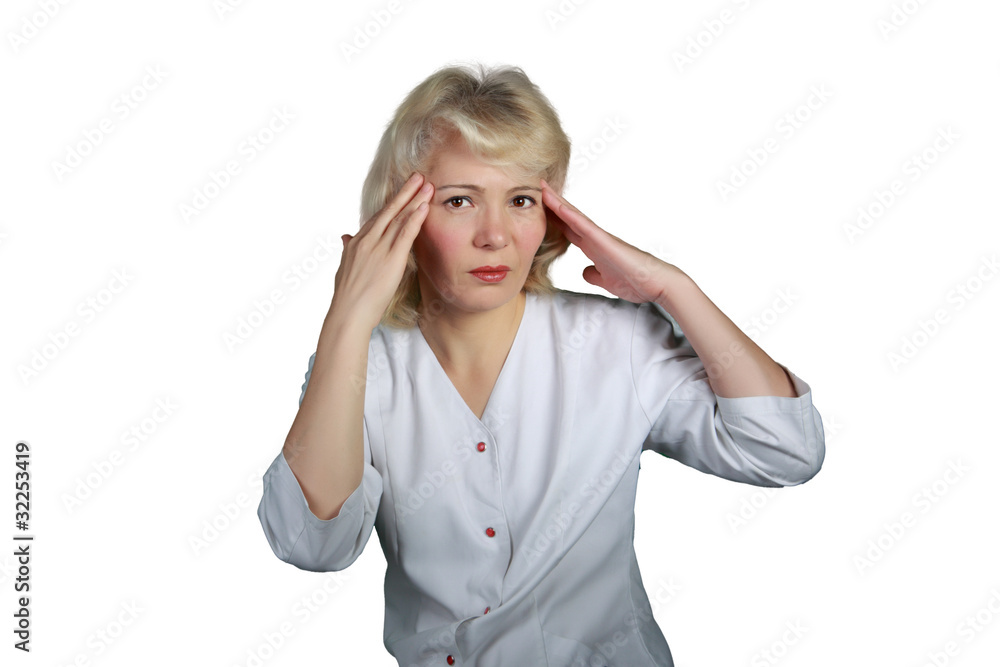 The woman in a white dressing gown rubs whisky from a headache The woman in a white dressing gown rubs whisky from a headache