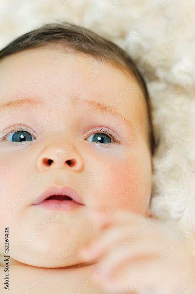 Beautiful baby boy is lying in a bed. Beautiful baby boy is lying in a bed.