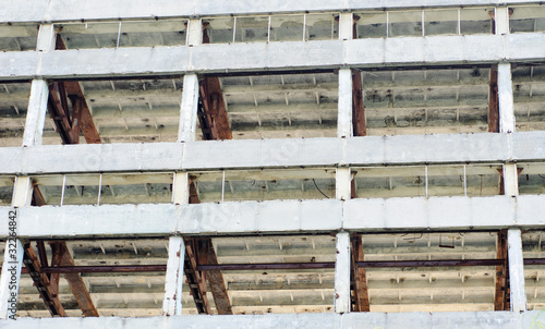 The frame of a building under demolition.Abstract background