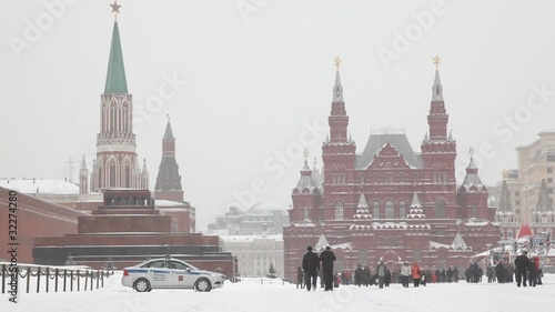 Large group of people at Moscow Red Square under snowfall
