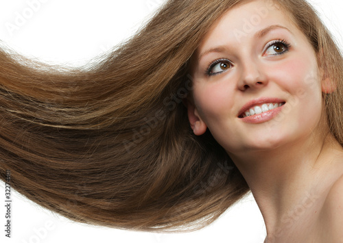 Healthy beautiful long hair closeup in motion created by wind