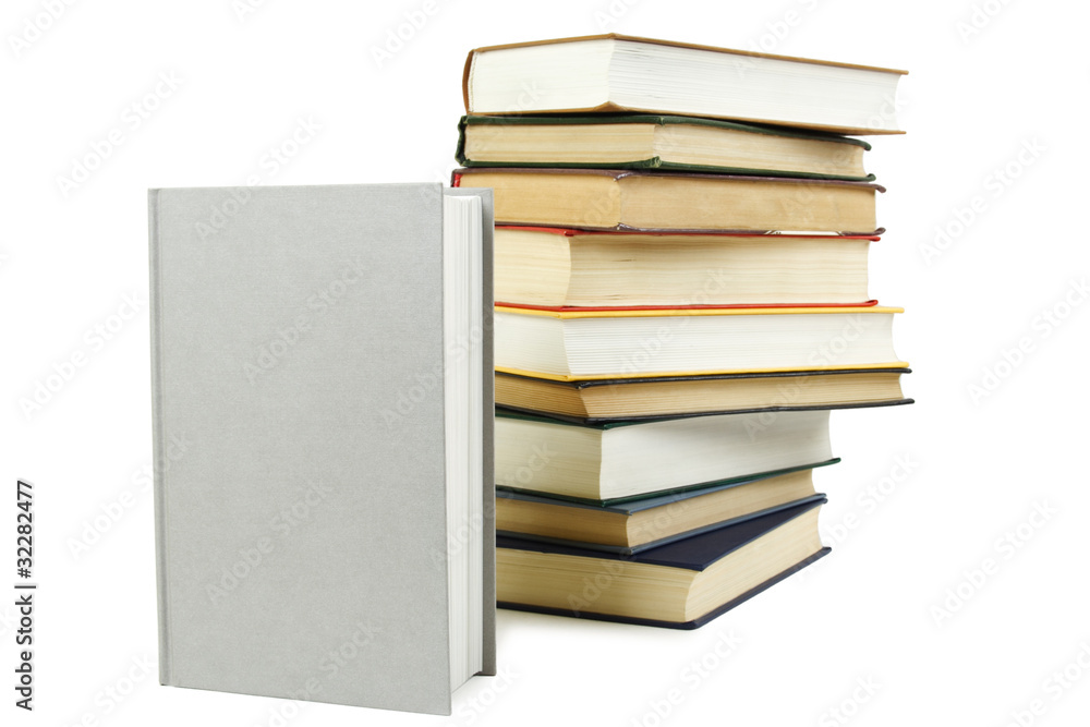 stack of books in hard cover and one closed book in front, isola stack of books in hard cover and one closed book in front, isola