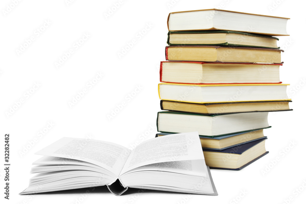 Naklejka premium stack of books in hard cover and one opened book in front, isola