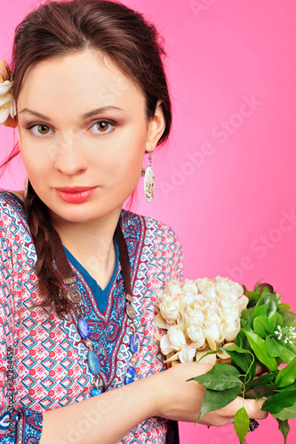 Portrait of a beautiful young girl in Asian clothing. photo