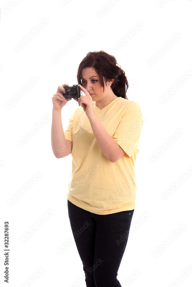 Teen girl photographer, in a yellow shirt Teen girl photographer, in a yellow shirt