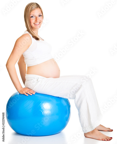 Pregnant woman excercises with gymnastic ball