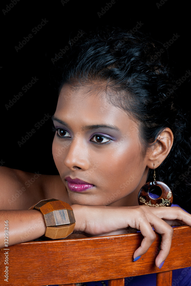 beautiful woman with chin resting on chair arm Stock Photo Adobe Stock