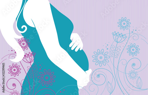 Silhouette of pregnant woman in flowers