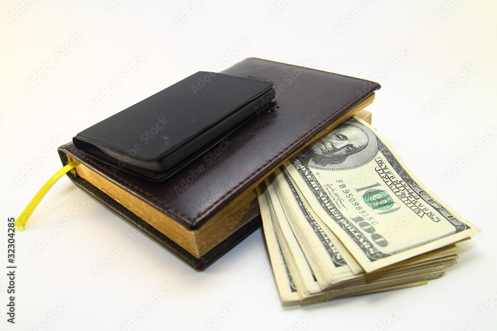 dollars money,calculator and note-book on white dackground dollars money,calculator and note-book on white dackground