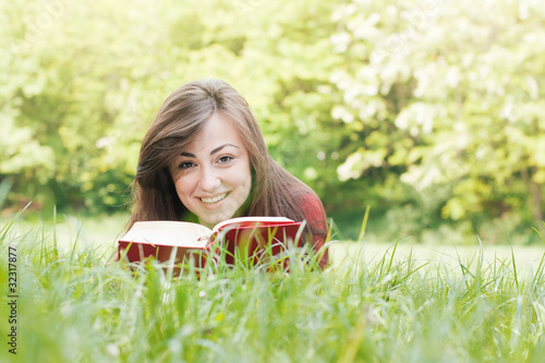 happy student outdoors relaxed © mitarart