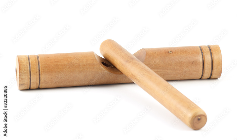 Αυτοκόλλητο Wooden claves isolated on a white background.