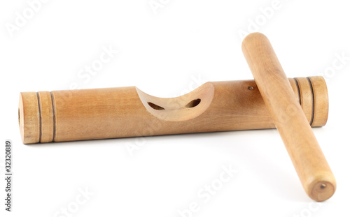 Wooden claves isolated on a white background. photo