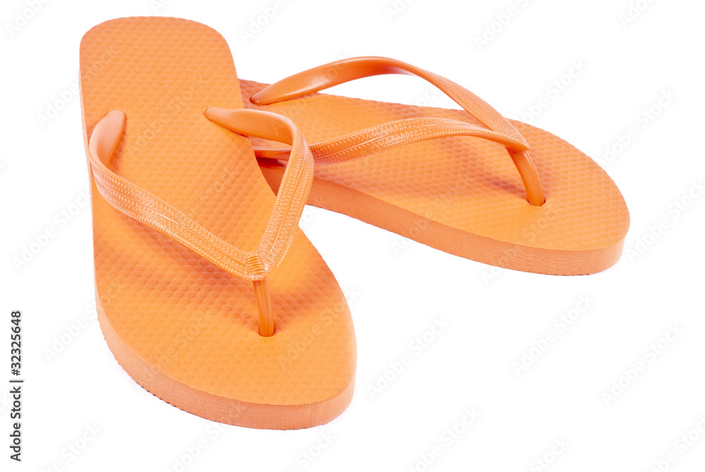 Fototapeta premium Pair of Orange Flip Flop Isolated on White