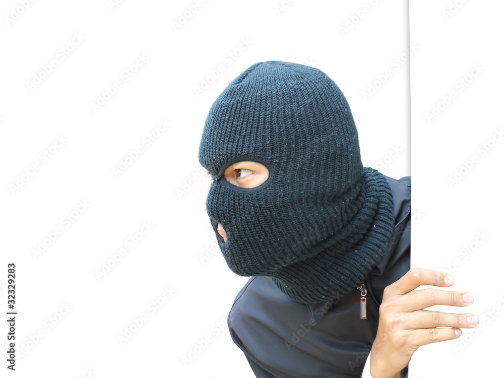 Robber Hiding  under a white wall