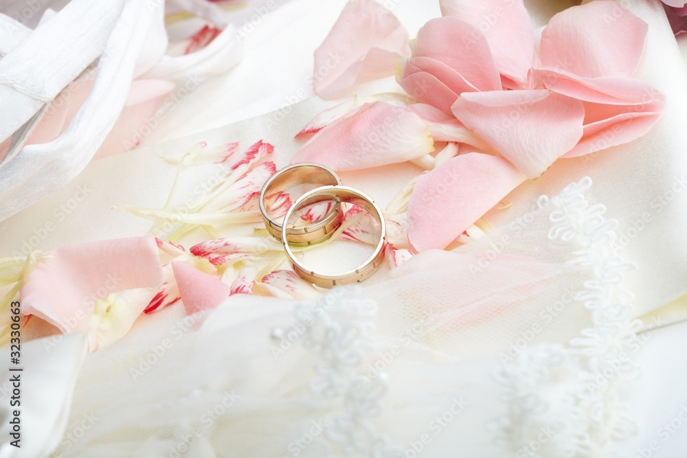 golden rings and rose petals