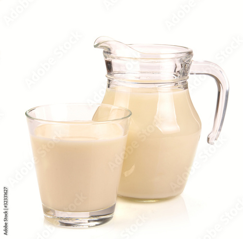 pitcher and a glass of milk
