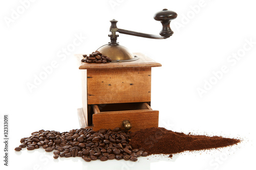 old wooden coffee grinder over white background