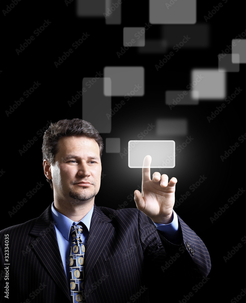 Business man pressing a touchscreen button Business man pressing a touchscreen button
