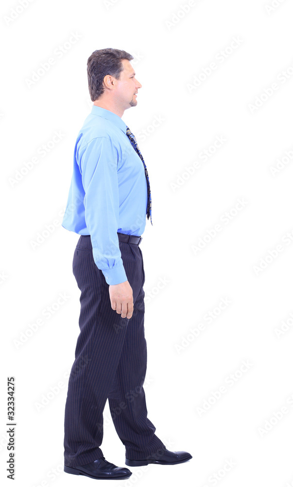 Full length profile of a middle aged business man Full length profile of a middle aged business man
