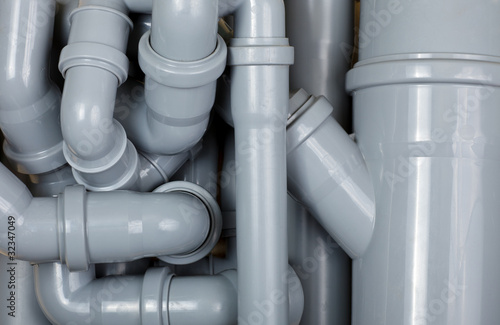 Grey PVC sewer pipes background photo