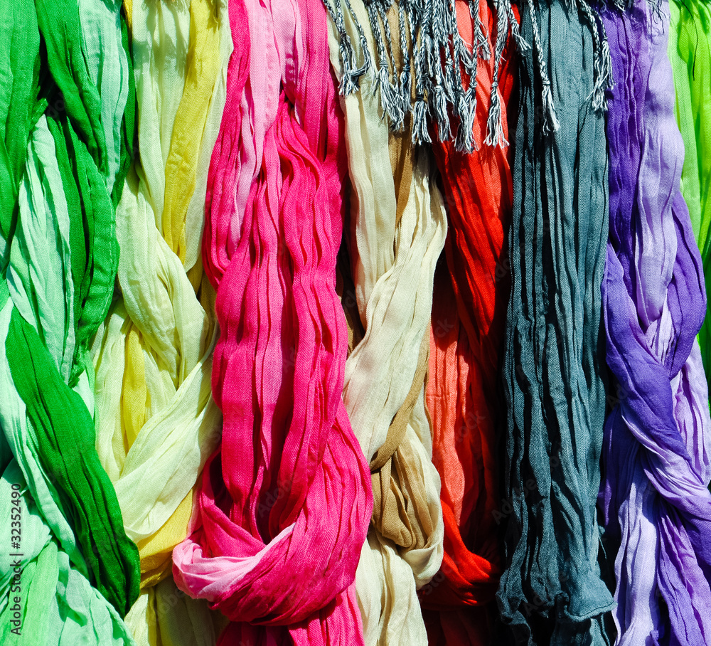 colorful scarves on a rack