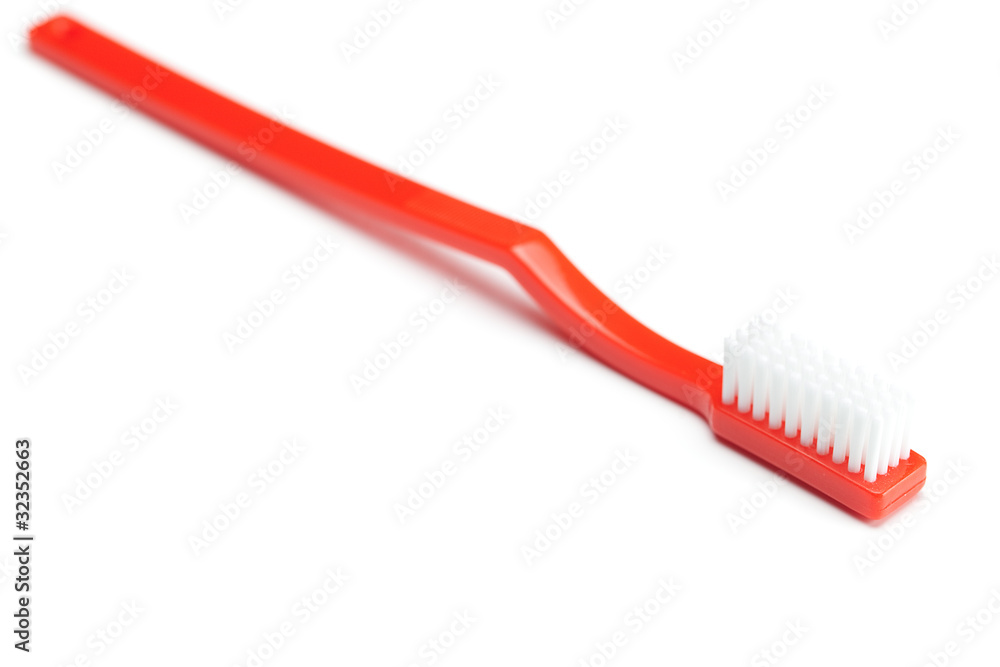 red toothbrush isolated on white red toothbrush isolated on white