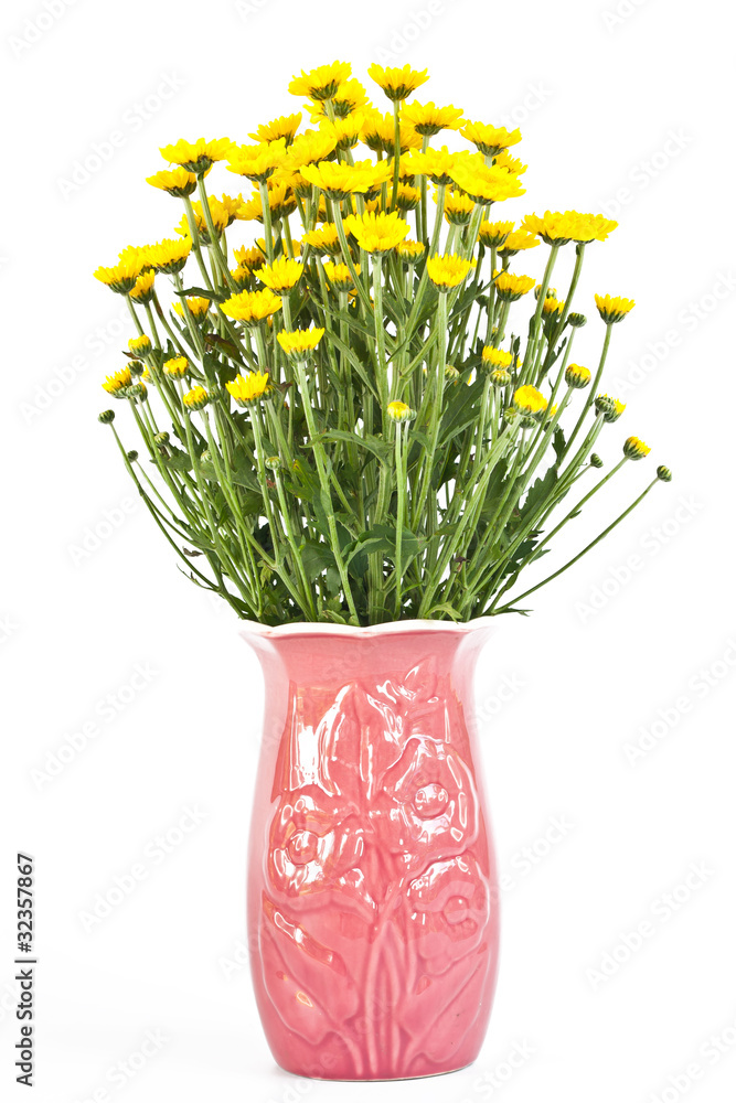yellow flowers in a vase .