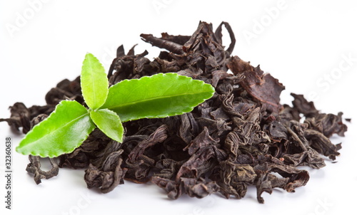 Bild auf Leinwand Heap of dry tea with green tea leaves.