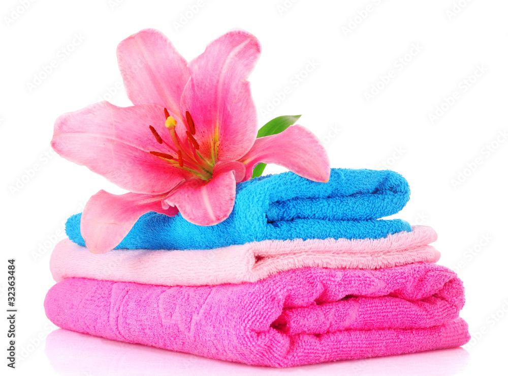 stacked colorful towels on a white background stacked colorful towels on a white background
