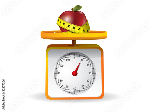 apple on kitchen food scale on white background