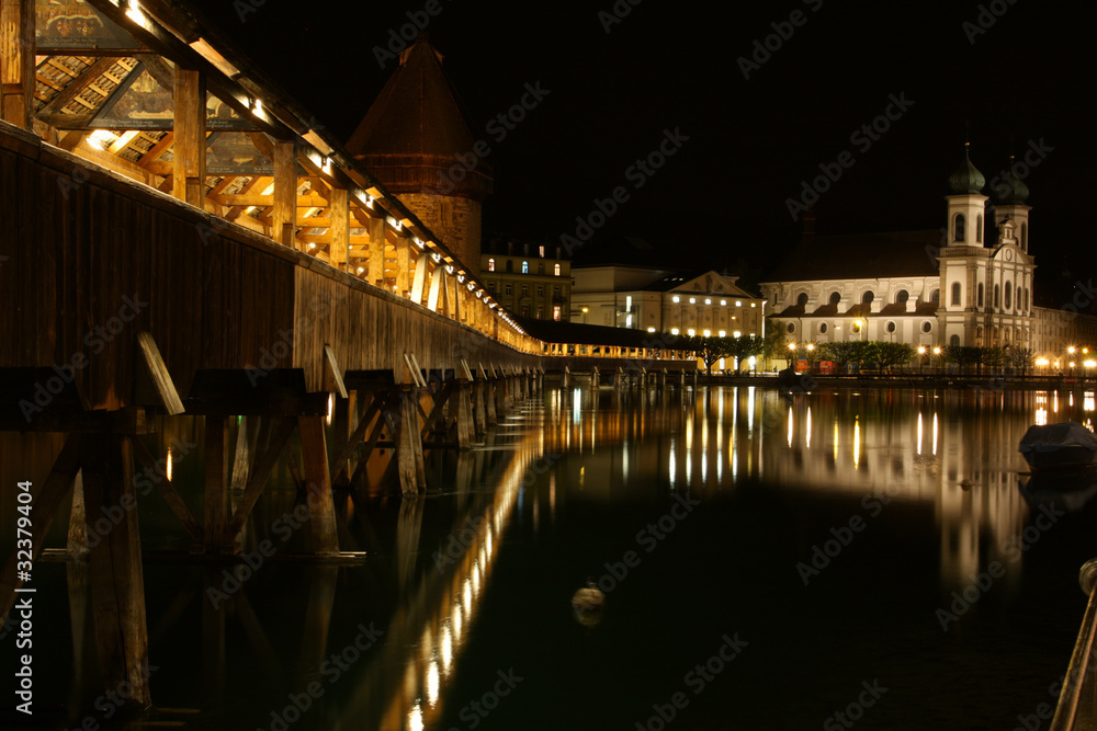 ancient bridge Kapellbrucke on a night at the Lucerne.