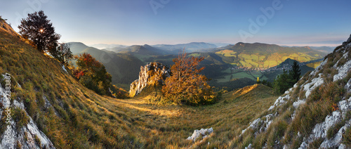 Rocky towny in green mountain at sunrise