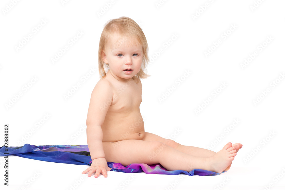 Adorbale baby sitting on kerchief on white Adorbale baby sitting on kerchief on white