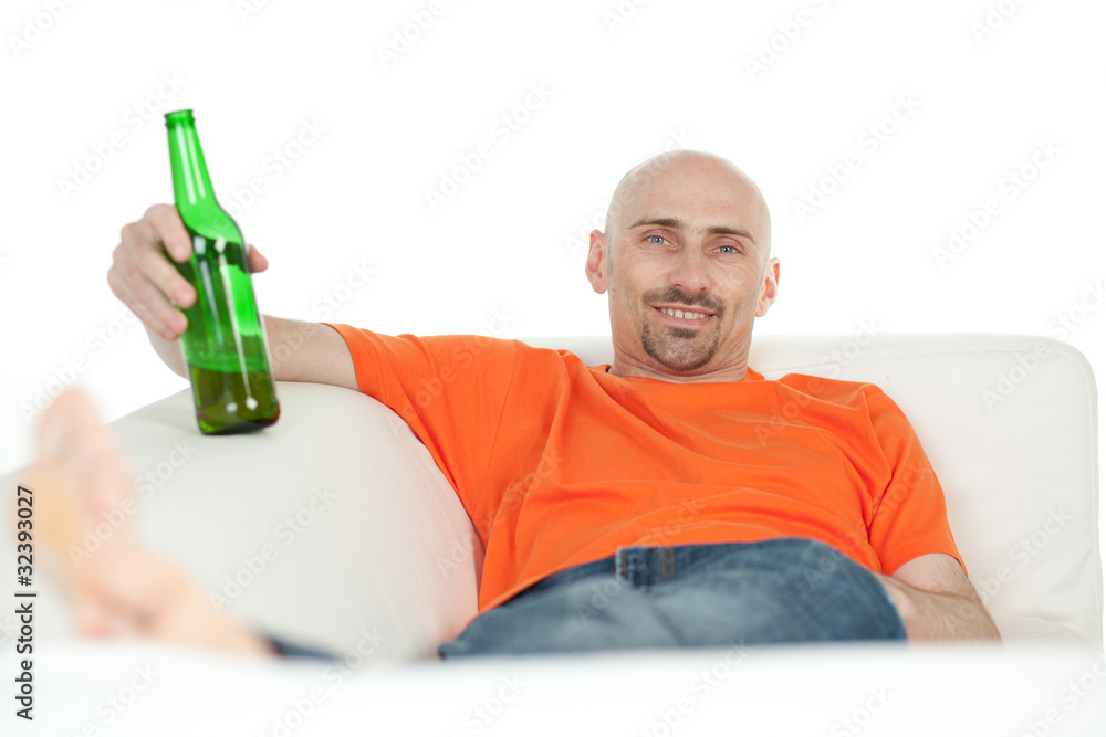 Man relaxing with beer bottle Man relaxing with beer bottle
