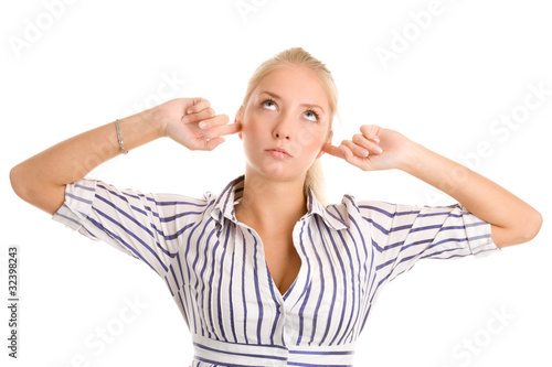 Woman plugs fingers in ears