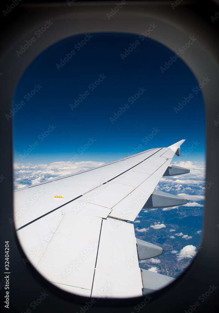 wing of airplane - view through the illuminator wing of airplane - view through the illuminator