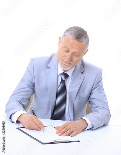 Portrait of a handsome mature business executive at work