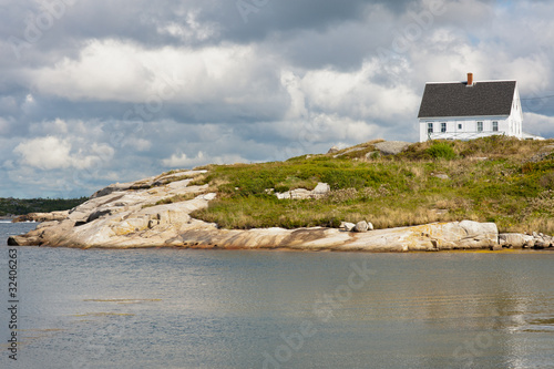 Picturesque house on the rocks in Peggys Cove, Nova Scotia photo