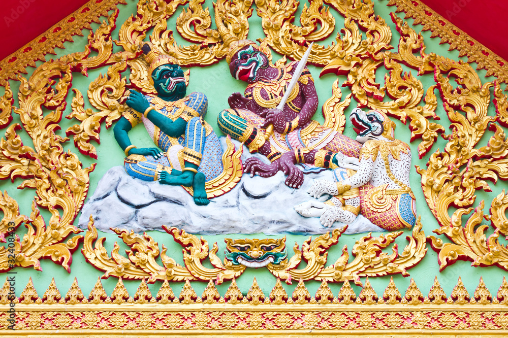 Art Ramayana story stucco church in front of the temple Thailand