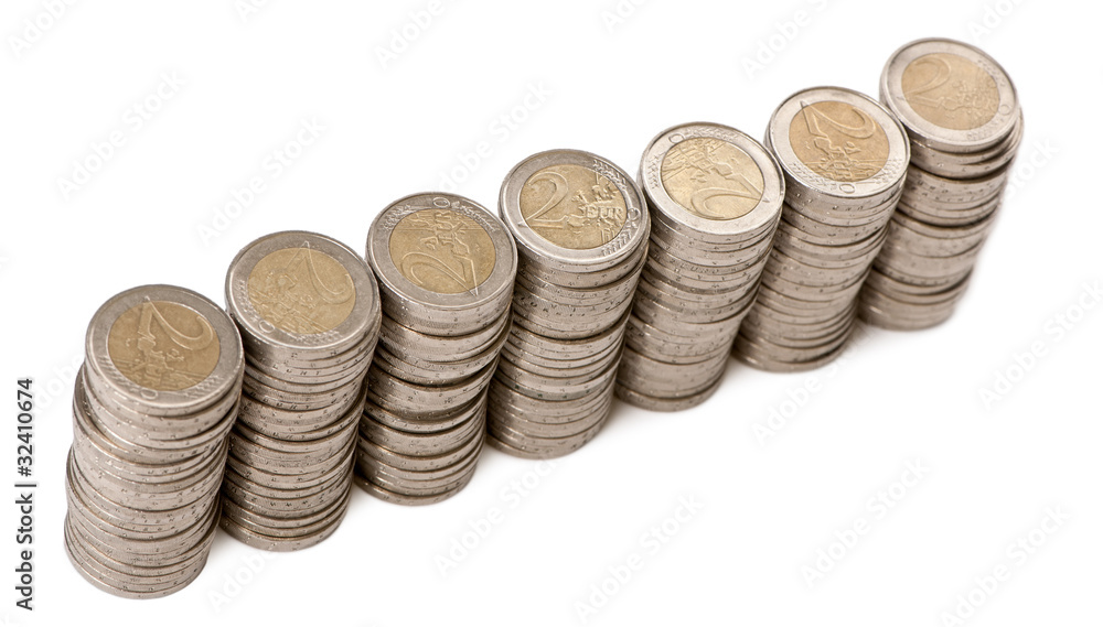 Stacks of 2 Euros Coins in front of white background Stacks of 2 Euros Coins in front of white background