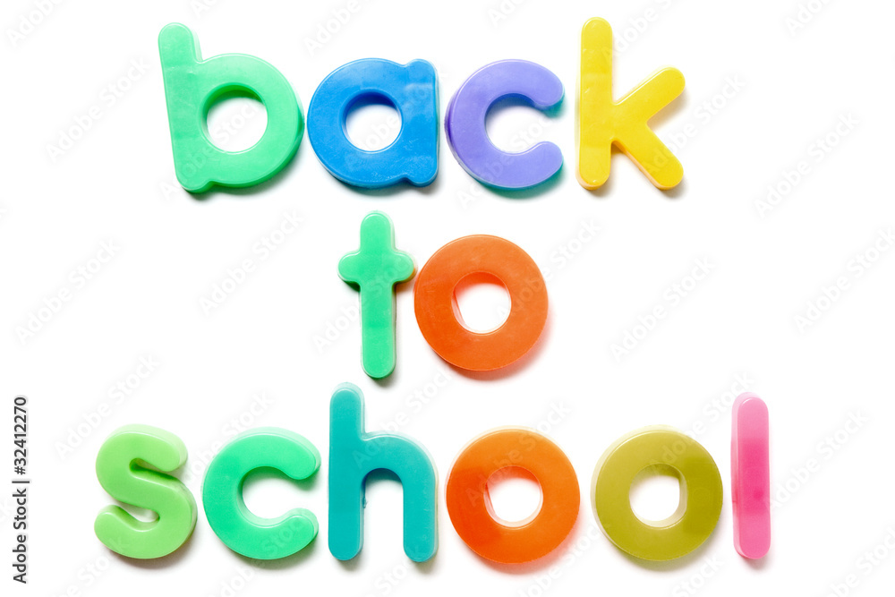 Sentence Back to school in colorful plastic letters over white Sentence Back to school in colorful plastic letters over white