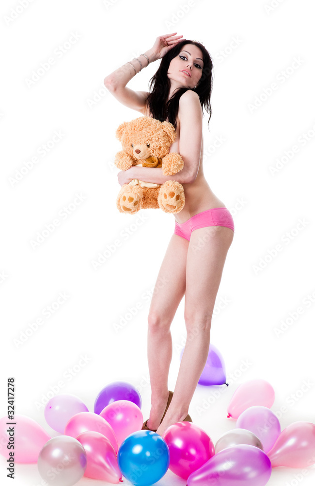Young sexy woman among the balloons, holding a teddy bear. Stock Photo |  Adobe Stock